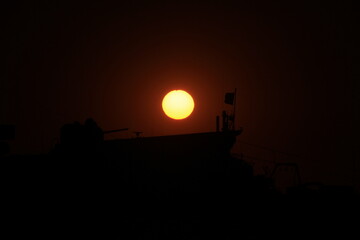 Fototapeta na wymiar sunset over military ship
