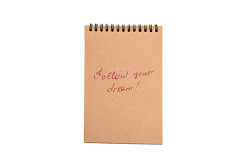 Positive statements. A phrase on a note sheet on a white background. Motivational concept with handwritten text. Craft notebook. phrase follow your dream