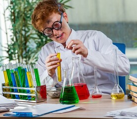 Young crazy chemist working in the lab