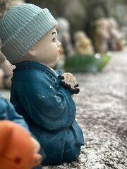 Closeup shot of a baby monk statue