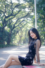 Naklejka premium asia thai teen black dress beautiful girl smile and relax