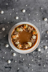 Sweet cheesecake with caramel on the table