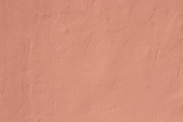 Light pink terracotta plaster rough wall texture background	