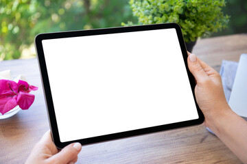 female hands hold computer tablet with isolated screen in cafe