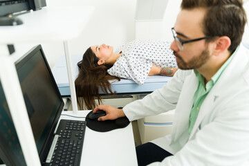 Young woman checking her bone density with a medical imaging test