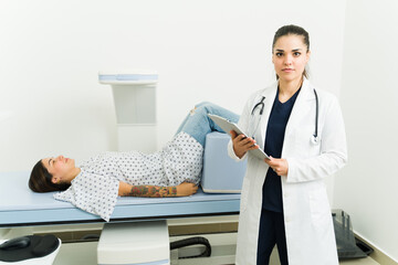 Female doctor making a patient diagnosis after doing a densitometry scan