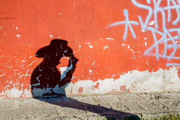 mans shadow on wall