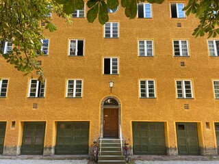 Old entrance to the house. Historic house with old architecture. Summer European courtyard.