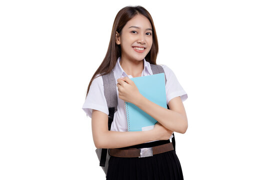 Portrait smiling of teen student girl of Asian ethnicity in university uniform hold backpack isolated over white background.