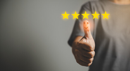 Hand with thumb up positive emotion smiley face icon and 5 star with copy space. Emotional smiley...
