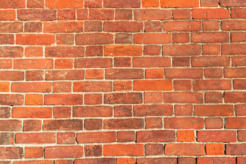 Section of red brick wall on a sunny day