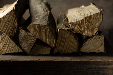 Logs of firewood for a firebox on a wooden texture