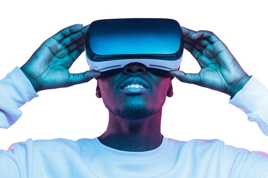 Virtual reality or metaverse concept. Close-up studio portrait of african man in VR glasses