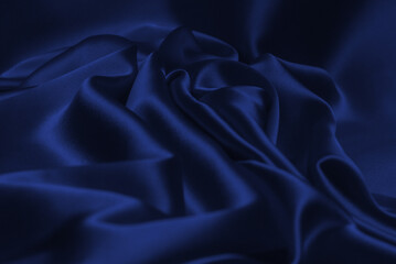 Rich and luxury red silk fabric texture background.