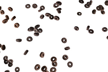 Chocolate rings cereal spill out into a bowl. Breakfast.