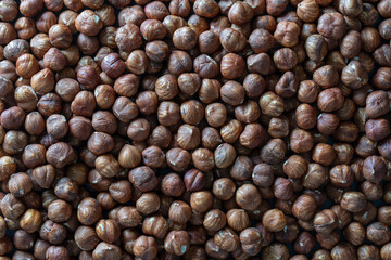 Dry hazelnuts background. Heap of peeled hazelnuts kernels
