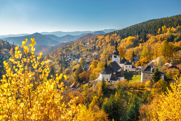 The Spania Dolina village with church and historic buildings in valley of autumn landscape, Slovakia, Europe. © Viliam