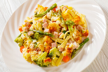 Ham and Noodle Casserole on white plate, top view