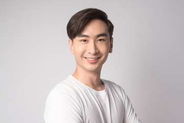 Portrait of young asian man over white background studio.