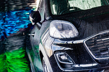 A vehicle in an automatic car wash