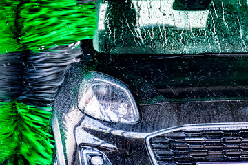 A vehicle in an automatic car wash