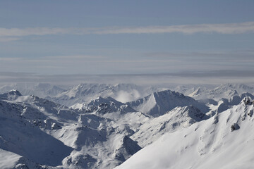 Fototapeta na wymiar Snow-capped mountain range in the Alps