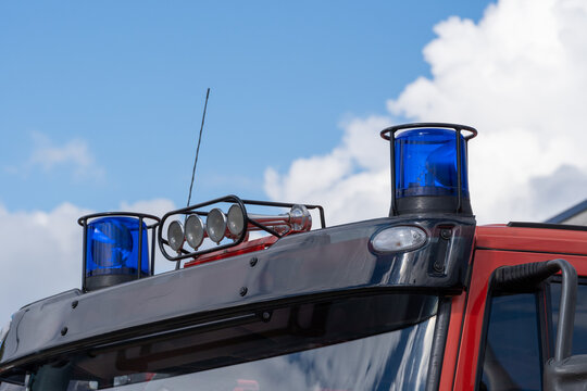 close-up picture of blue lights and sirens on a fire-truck against blue sky
