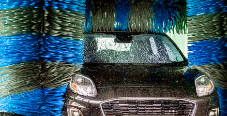 A vehicle in an automatic car wash