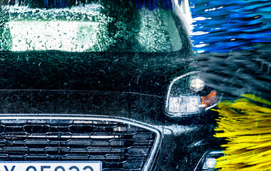 A vehicle in an automatic car wash