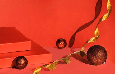 Red podium of gift boxes golden ribbon. Christmas background with podium for product display. Red...