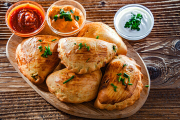 Composition with a dish of oven-baked pierogi