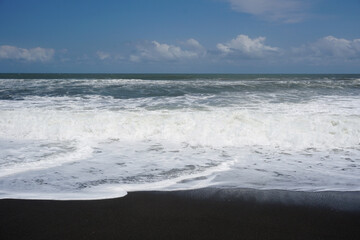 splash of waves on a tropical beach during the day  