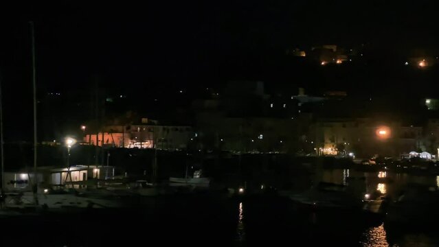 Procida port and boats at night