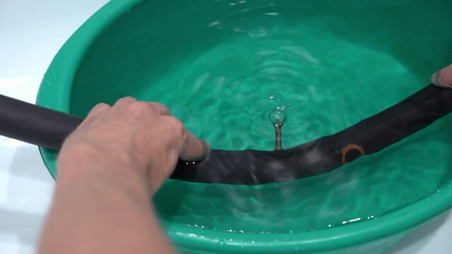 checking the bicycle camera for air passage by immersion in water