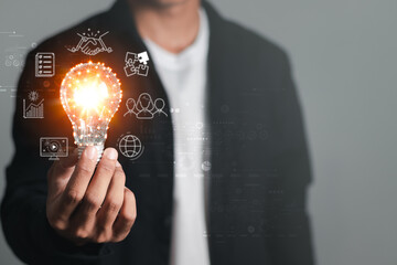 Hand holding light bulb with cloud computing icon and global internet connection technology. Global Business and Digital Marketing, Internet Connectivity, Finance and Banking. digital link technology