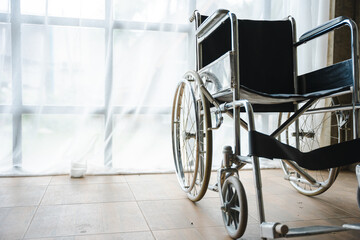Close up view of empty wheelchair waiting for patient services with vintage filtered.