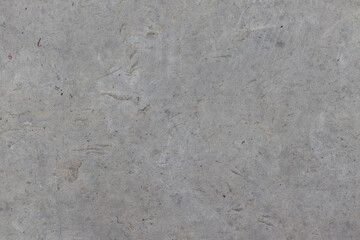 Texture of a stone wall with cracks and scratches which can be used as a backgr. The texture of the stone.
