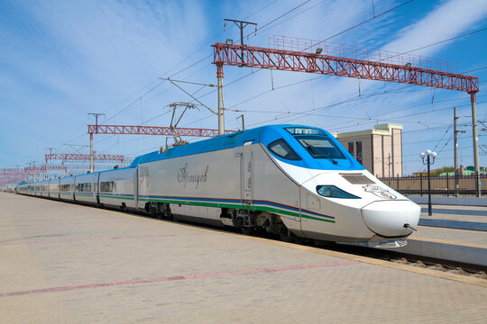 BUKHARA, UZBEKISTAN - SEPTEMBER 11, 2022: Talgo 250 "Afrosiyob" high-speed train at the Bukhara station platform on a sunny day