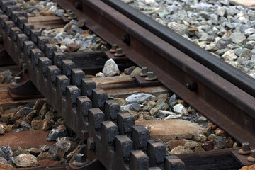 Close-up of a railroad track with a rack
