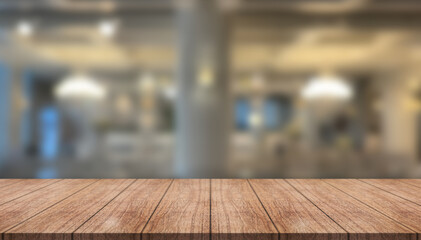 Empty wooden table top with lights bokeh on blur restaurant background.