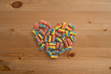 Colorful marmalades on the table in the shape of a heart