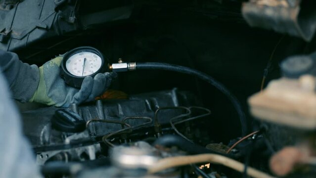 measurement of compression pressure in the cylinders of a car engine.
