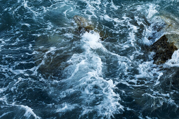 Fototapeta na wymiar Waves on rocks, mediterranean sea, nature and backgrounds
