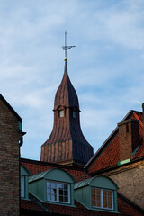 Obraz premium Tower and roofs against blue sky in Lund Sweden