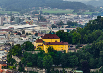 Naklejka premium Yellow building on mountain in Salzburg Austria