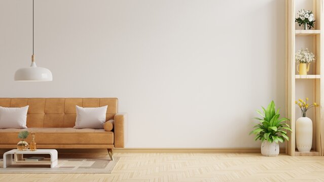 Living room wall mock up with leather sofa and decor on white background.