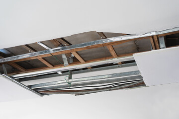 Ceiling panels broken and damage from car crash ,Home maintenance and repair home concept.