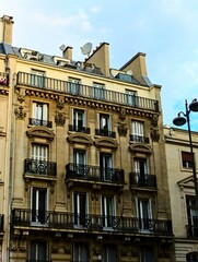 Fototapeta premium Paris, September 2022 : Visit of the magnificent city of Paris, Capital of France - View on different facades of buildings built by Baron Haussmann
