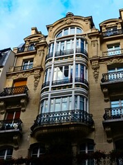 Paris, September 2022 : Visit of the magnificent city of Paris, Capital of France - View on different facades of buildings built by Baron Haussmann