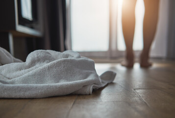 white towel on the floor in bedroom interior , white towel on the floor in the hotel room